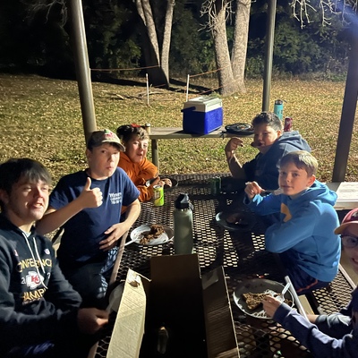 Sabetha Boy Scouts  enjoying Dutch oven Brownies at John Redmond Reservoir camp out.