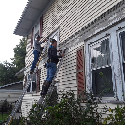 Sabetha H.S. students working on a house painting project